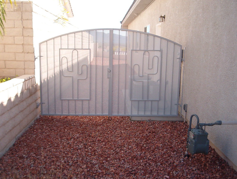 white entryway gate with cactus design