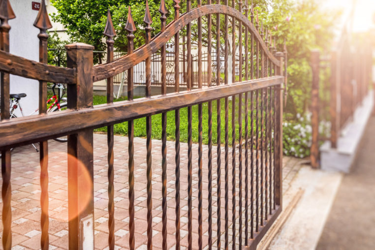 wrought iron fence gate in front of home